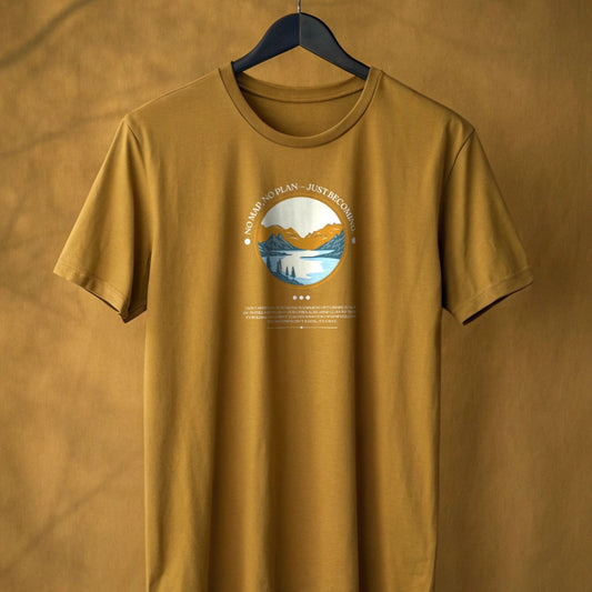 Brown t-shirt with a graphic design on a brown background designed and developed by boone and beetle